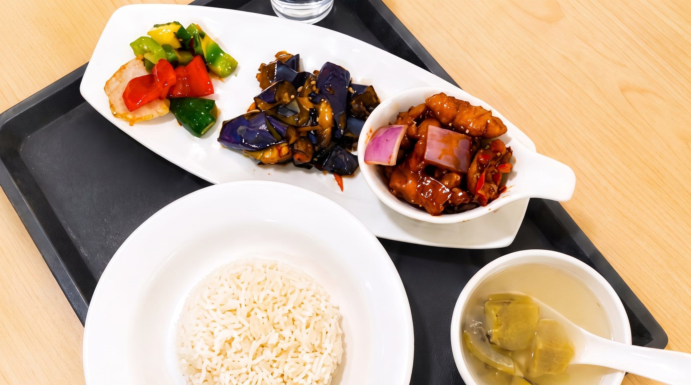 Balanced meal tray with rice, soup and dishes — less sugar